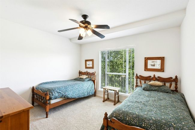 Carpeted bedroom featuring a ceiling fan | Image 21