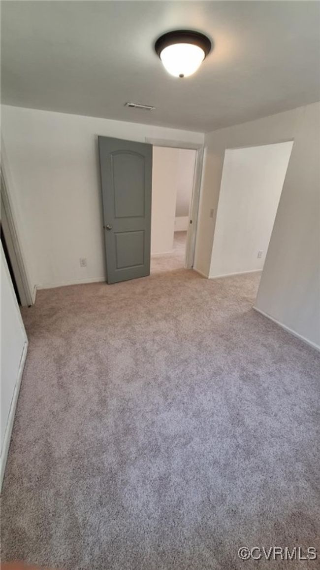 Spare room with visible vents and carpet flooring | Image 30