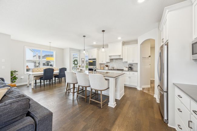 Another view of the kitchen and casual eating area. | Image 9