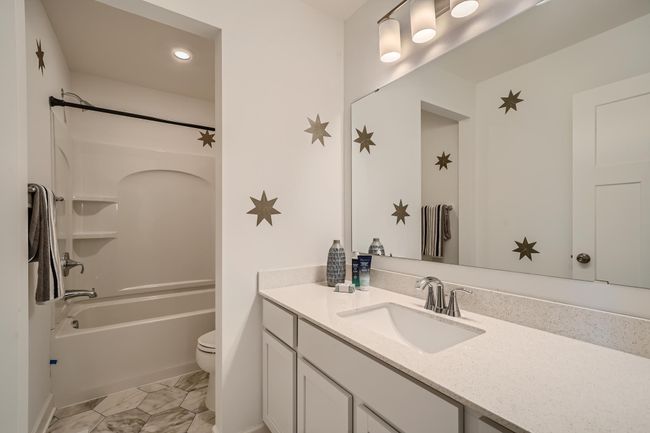 Photo is of the model. Spacious full bath off the upper level provides plenty of space for everyone to get ready during those busy mornings. | Image 19