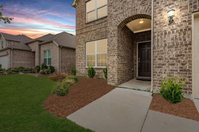 Exterior entry at dusk featuring a yard | Image 2