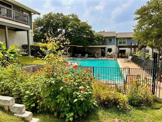 Community pool with a patio area | Image 14