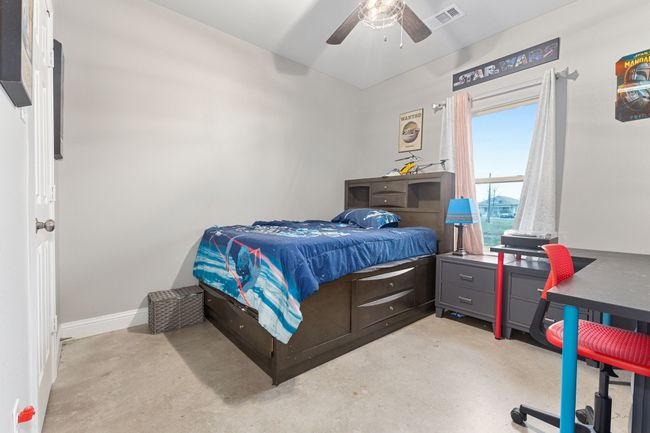 Bedroom featuring ceiling fan | Image 21