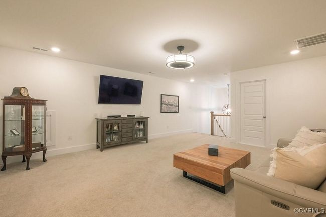 Living area featuring light colored carpet and recessed lighting | Image 36