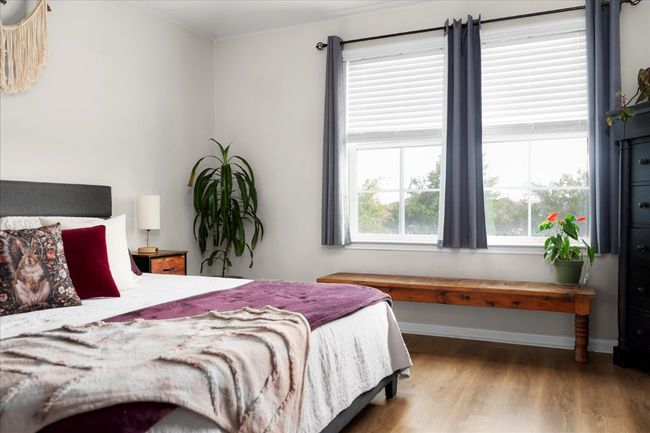 Bedroom with wood finished floors and baseboards | Image 15