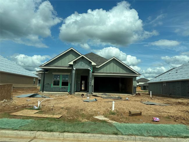 Property under construction featuring board and batten siding and a garage | Image 23