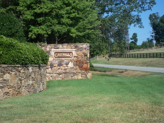 Community sign featuring fence and a lawn | Image 15