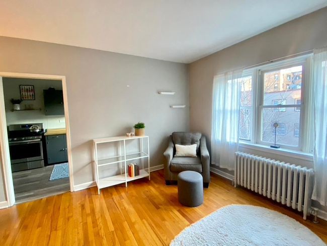 Warm wood floors, furniture included so you can just move in and enjoy! | Image 8