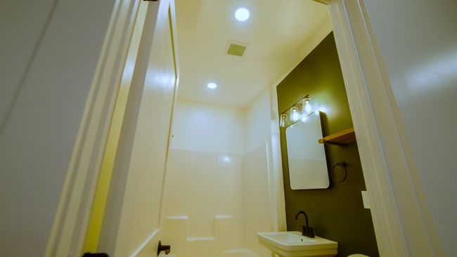 Bathroom with a sink and recessed lighting | Image 36