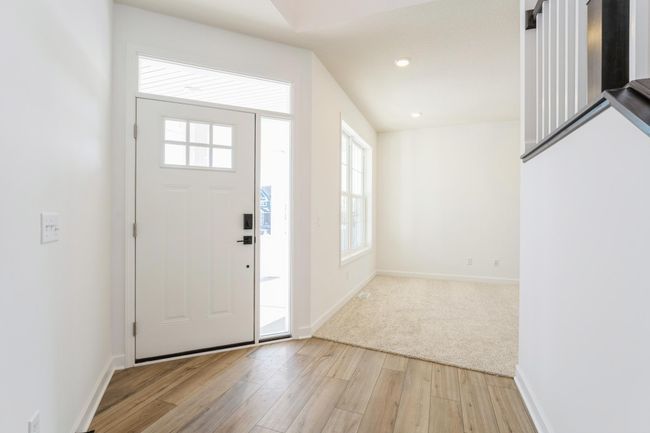 (Photo of a decorated model, actual homes finishes will vary) The stunning fireplace in the great room! | Image 8