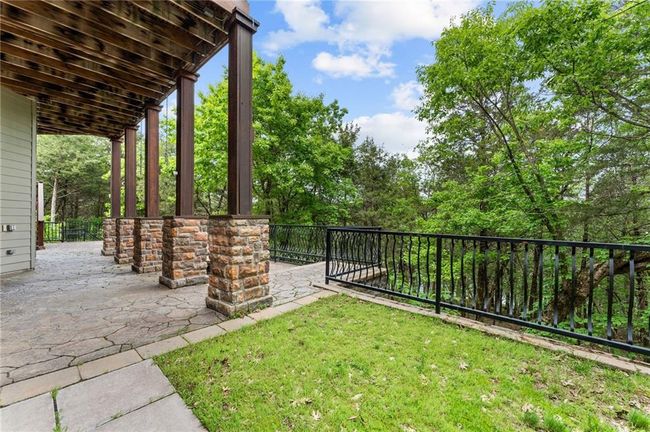 View of yard featuring a patio and fence | Image 57