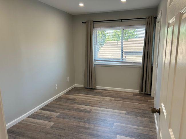 Empty room featuring recessed lighting, dark wood-type flooring, and baseboards | Image 39
