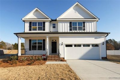 The Davidson offers 5 bedrooms, 3 baths, and a 2-car garage with a FIRST-FLOOR GUEST SUITE! Durable EVP flooring throughout the first floor main living areas. | Image 1