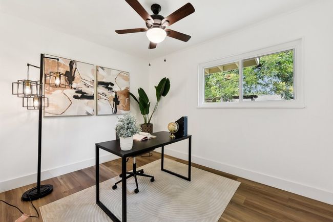 Office area featuring ceiling fan, baseboards, and wood finished floors | Image 14