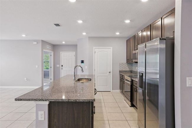 15250 Aquarius Way, House other with 3 bedrooms, 2 bathrooms and null parking in MASCOTTE FL | Image 9