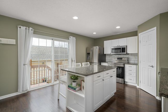 Granite Counters, stainless steel appliances, spacious pantry | Image 7