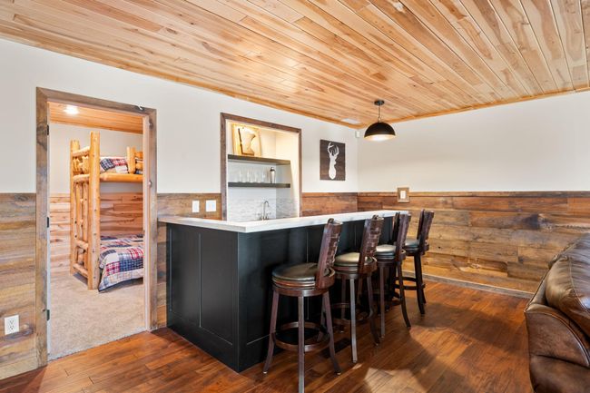 Brand new wet bar with open shelving and cabinetry. | Image 27