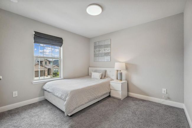 Bedroom #3 is a true guest suite with its own full bath inside the bedroom. | Image 25