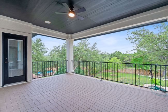 View of patio / terrace featuring a ceiling fan and a balcony | Image 18