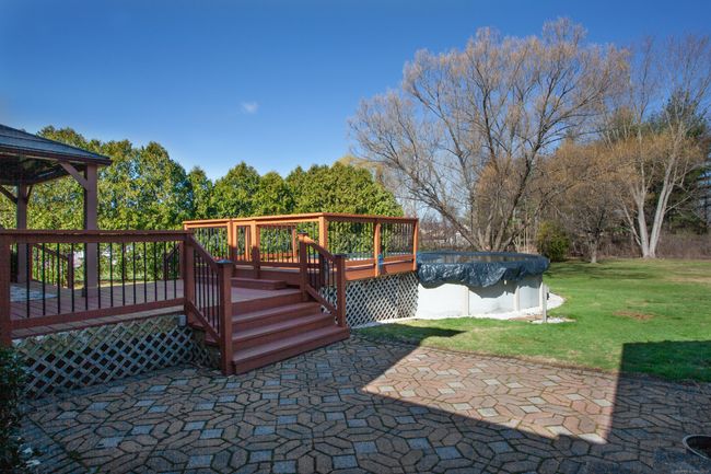 Expansive backyard with above ground pool | Image 29