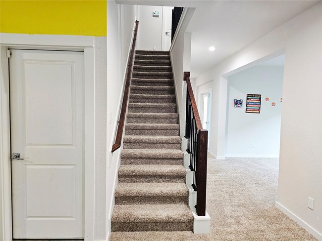 Another view of the stairs, 2 car garage entry door | Image 7