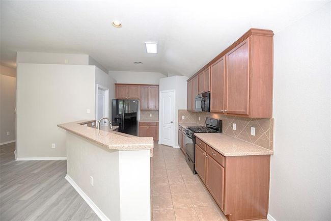 Another view of this great kitchen from the dining area. | Image 15