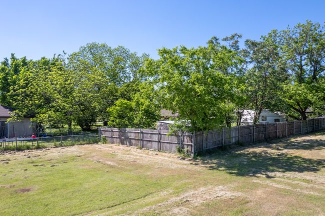 View of yard with a trampoline | Image 32