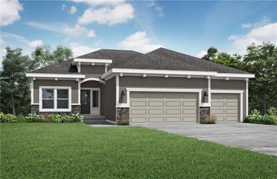 View of front facade with a front yard and a garage | Image 1