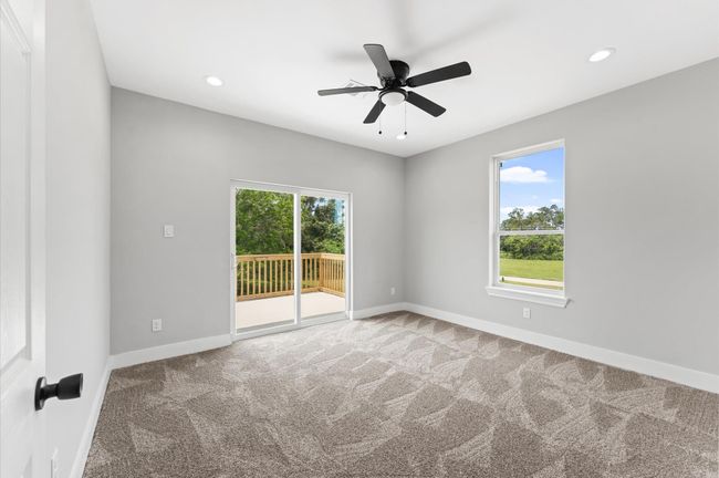 Spacious secondary bedroom with access to the balcony and lake views | Image 21