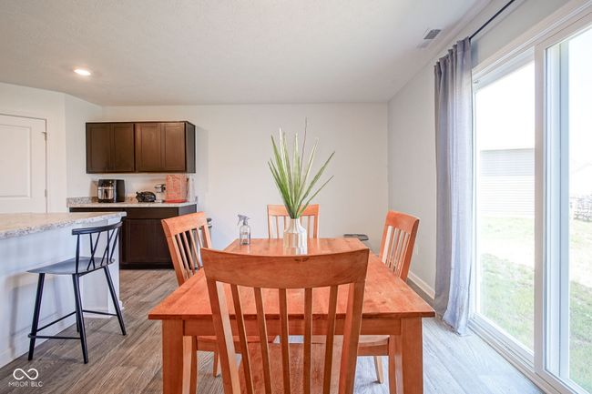 dining room featuring light wood finished floors and recessed lighting | Image 11
