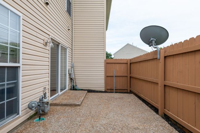 Extend your living space outdoors with this cozy and functional patio. | Image 28