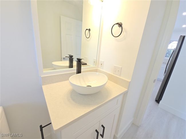 Bathroom featuring vanity, wood finished floors, and baseboards | Image 32