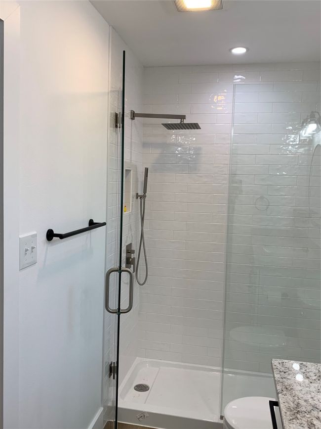 Full bathroom featuring a stall shower, vanity, and recessed lighting | Image 12