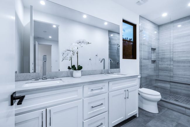 Bathroom featuring double vanity, a shower stall, and recessed lighting | Image 29