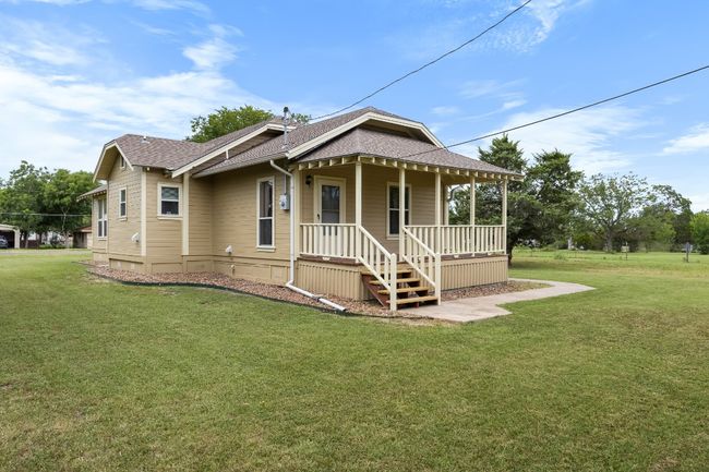 Rear view of property covered porch | Image 27