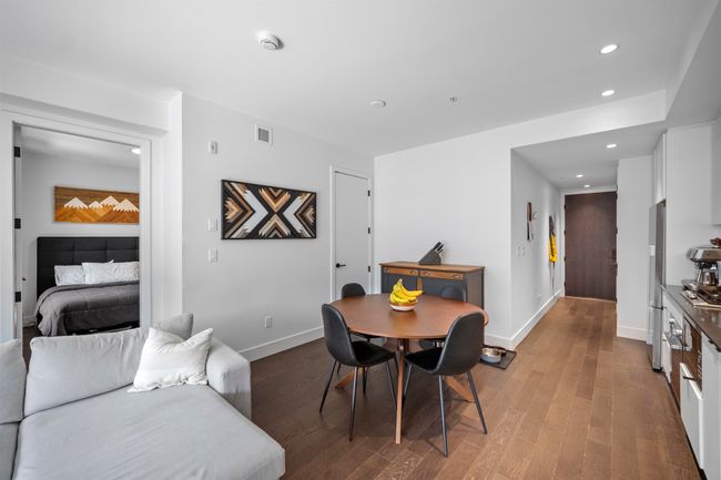 Dining space featuring dark wood-type flooring and recessed lighting | Image 7