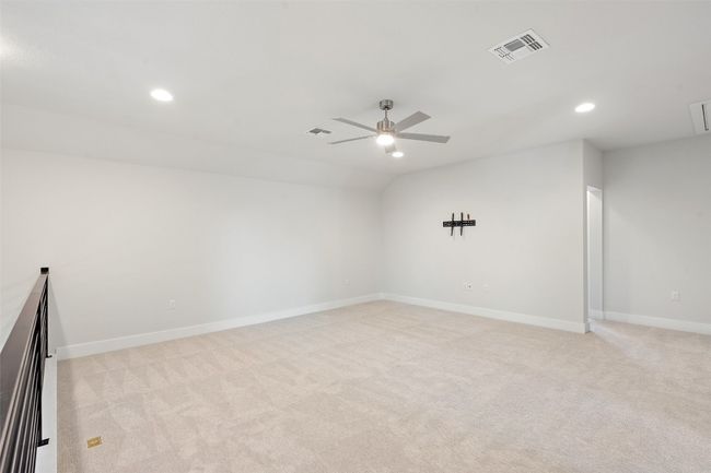 Empty room with recessed lighting, light colored carpet, a ceiling fan, and vaulted ceiling | Image 26