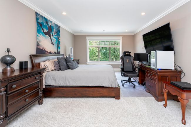 Bedroom featuring light colored carpet, recessed lighting, and crown molding | Image 14