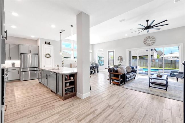 Open concept living with upgraded flooring throughout | Image 16