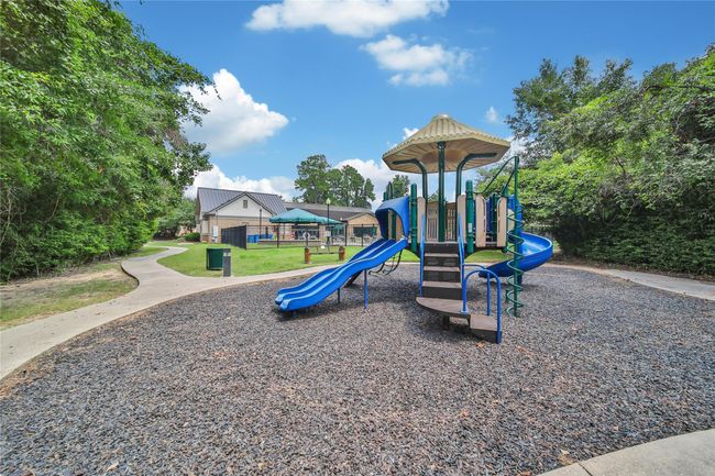 Behind the pool is another neighborhood playground. | Image 38