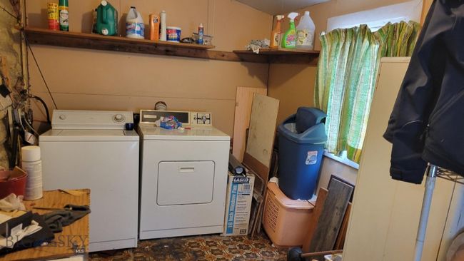 Washroom with washing machine and clothes dryer | Image 9