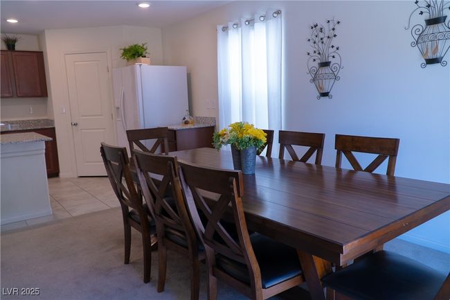 Dining space with recessed lighting, light carpet, and light tile patterned floors | Image 27