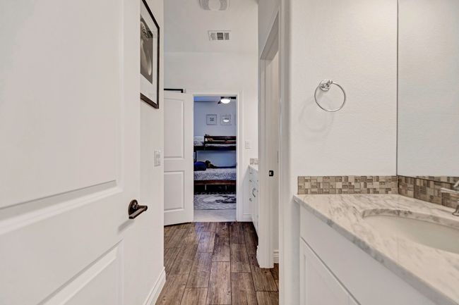 Bathroom with vanity and wood finished floors | Image 20