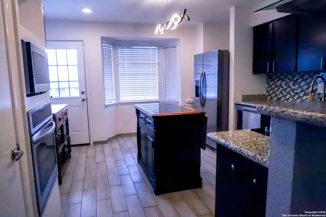 Back door to covered balcony patio | Image 9