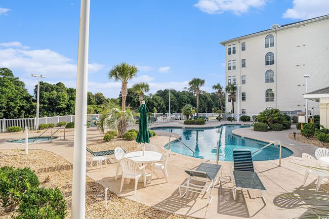 Community pool featuring a patio | Image 23