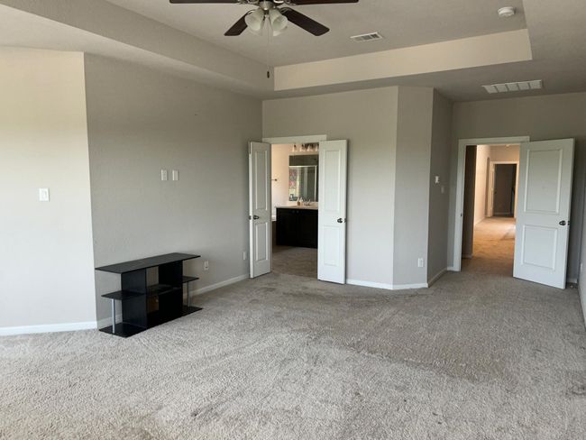Unfurnished bedroom with carpet and baseboards | Image 26