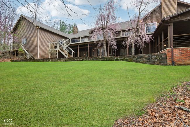 view of yard featuring a deck and stairs | Image 50