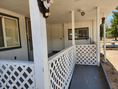 Kitchen and front room entry off porch. | Image 2