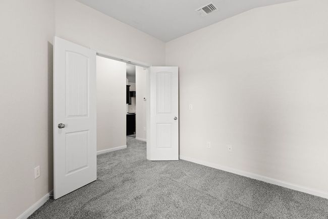 Unfurnished bedroom featuring carpet flooring and baseboards | Image 7