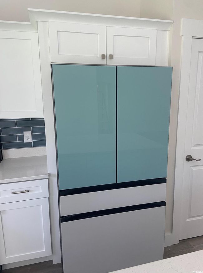 Detailed view of backsplash and white fridge | Image 15